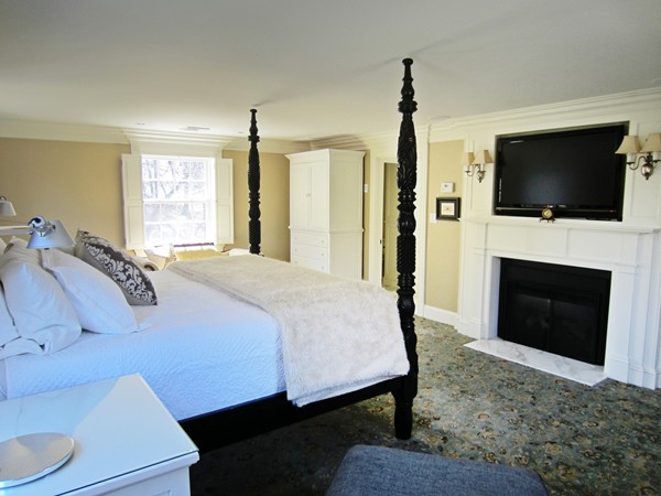 47 Carisbrooke Road Wellesley, MA 02481 - Photo 14 of 24 a spacious bedroom with a bed and a flat screen tv