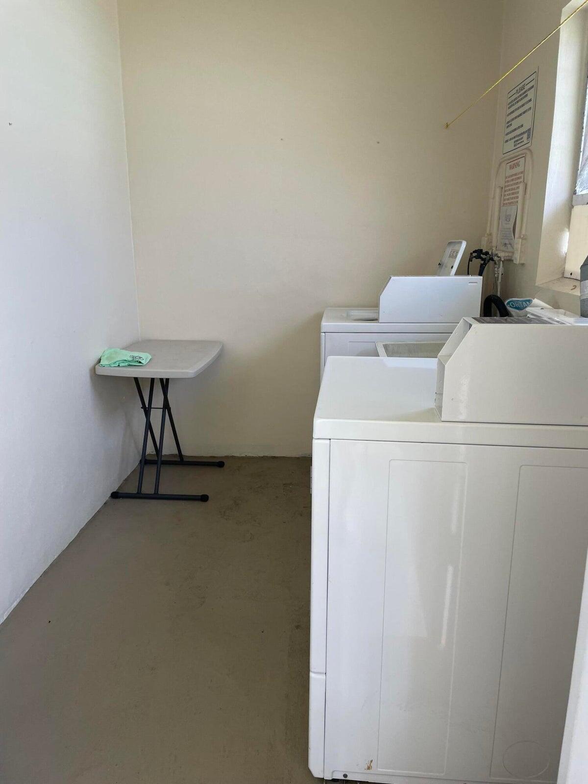 2131 Northeast 42nd Court, Unit 210E Lighthouse Point, FL 33064 - Photo 18 of 22 a utility room with dryer and washer