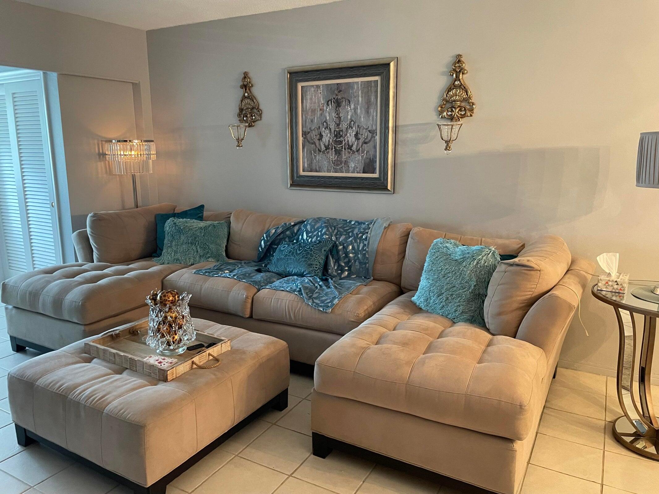 2131 Northeast 42nd Court, Unit 210E Lighthouse Point, FL 33064 - Photo 10 of 22 a living room with furniture and a couch