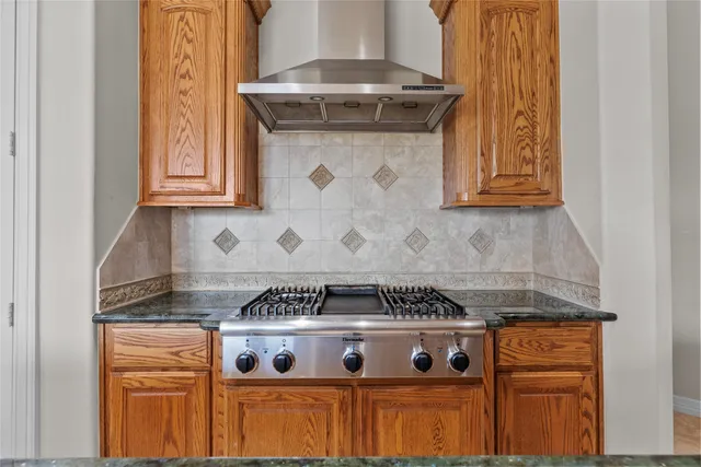 a bathroom with a sink a large mirror and a shower