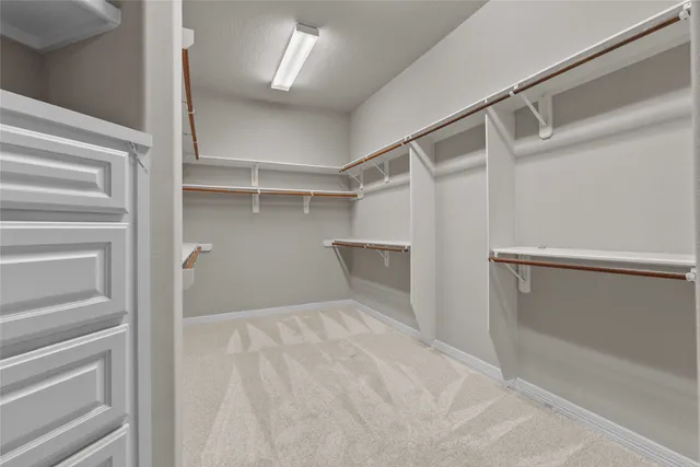 a view of a livingroom with a ceiling fan and window