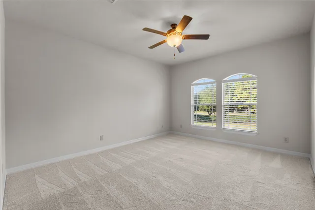 a view of a livingroom with a furniture and a ceiling fan