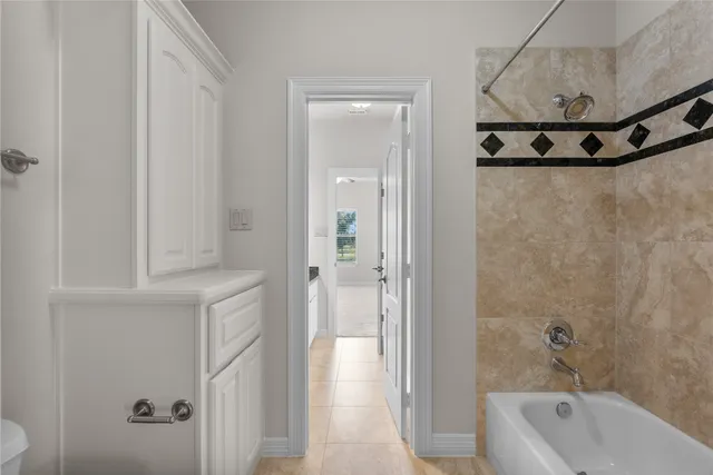 a view of a house with pool and sitting area