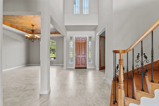 a view of an entryway with wooden floor