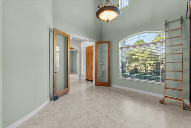 a view of an empty room with a empty space and a window