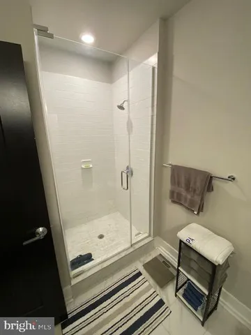 a bathroom with a shower a toilet and a sink