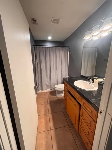 a bathroom with a sink a mirror and a bathtub