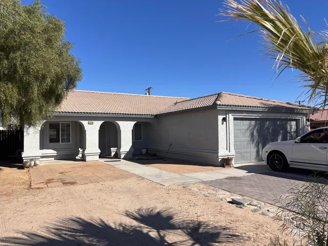 a view of a car parked in front of a building