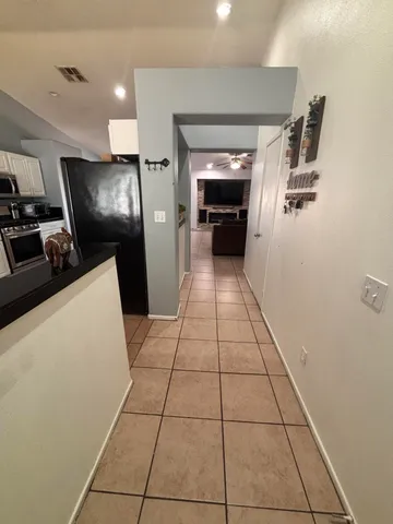 a view of hallway with washer and dryer