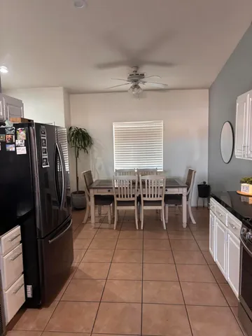 a view of a dining room kitchen and a window