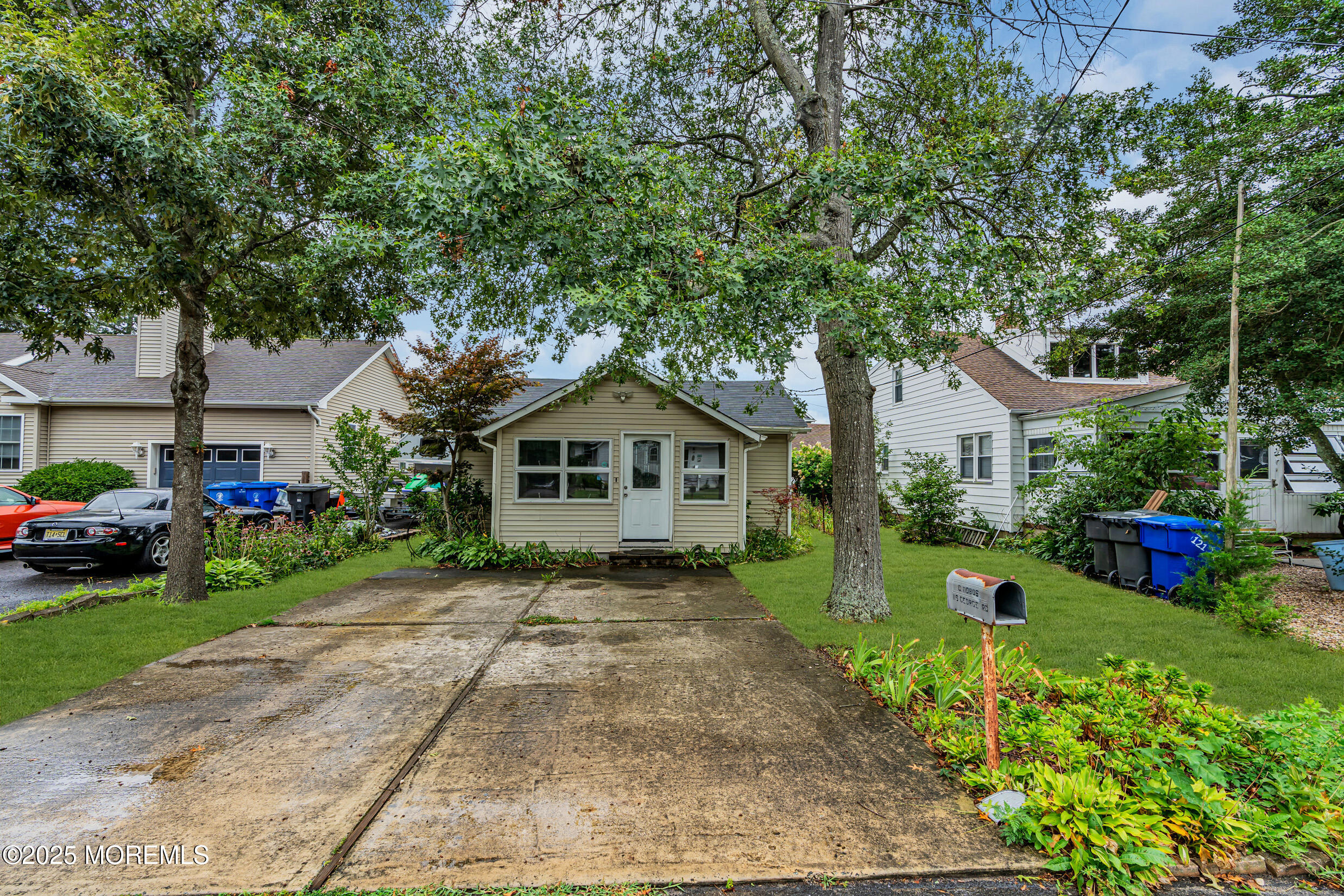 119 George Road Toms River, NJ 08753 - Photo 1 of 29 a front view of a house with a yard and garage