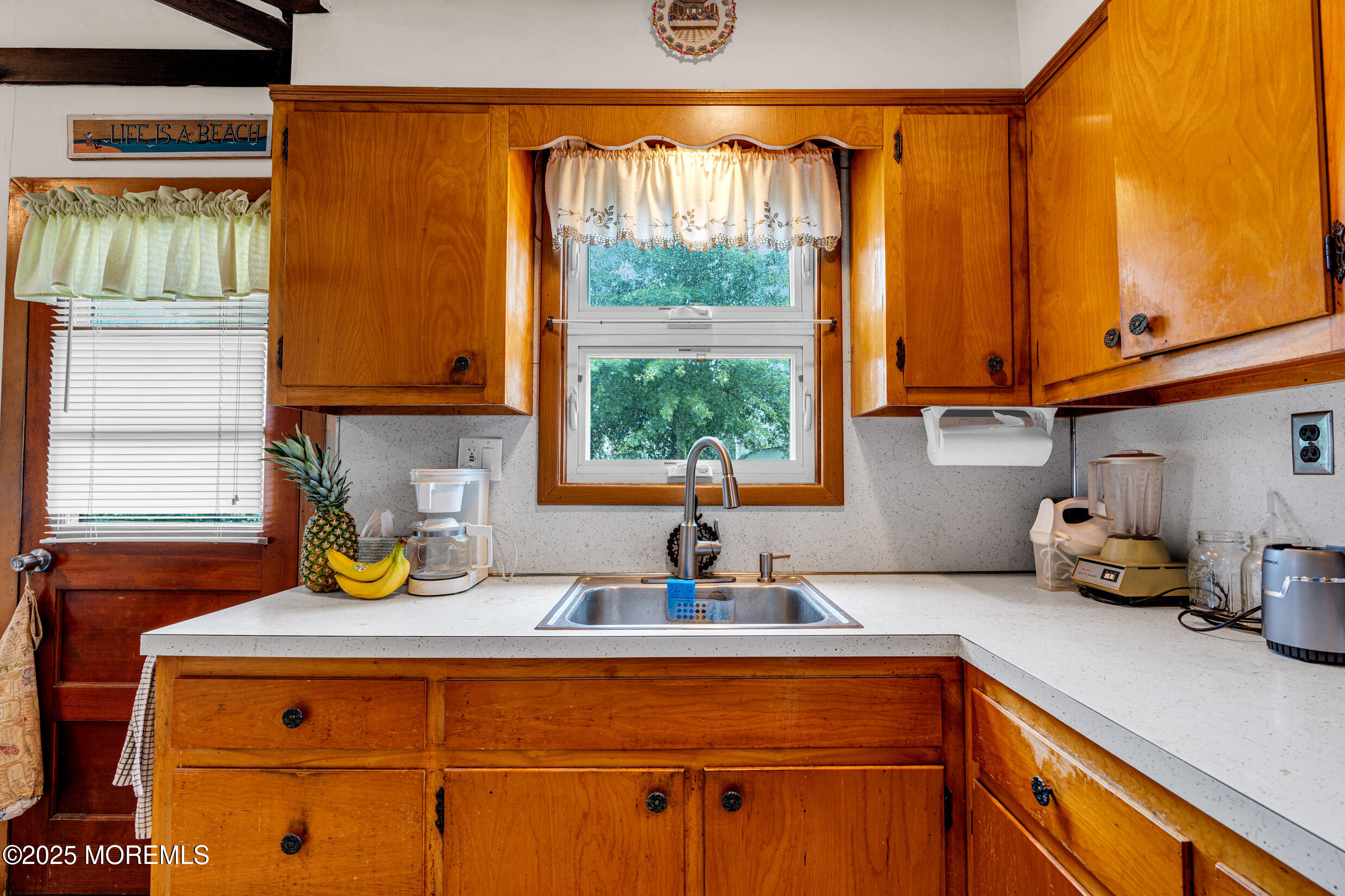 119 George Road Toms River, NJ 08753 - Photo 11 of 29 a kitchen with a window a sink and cabinets