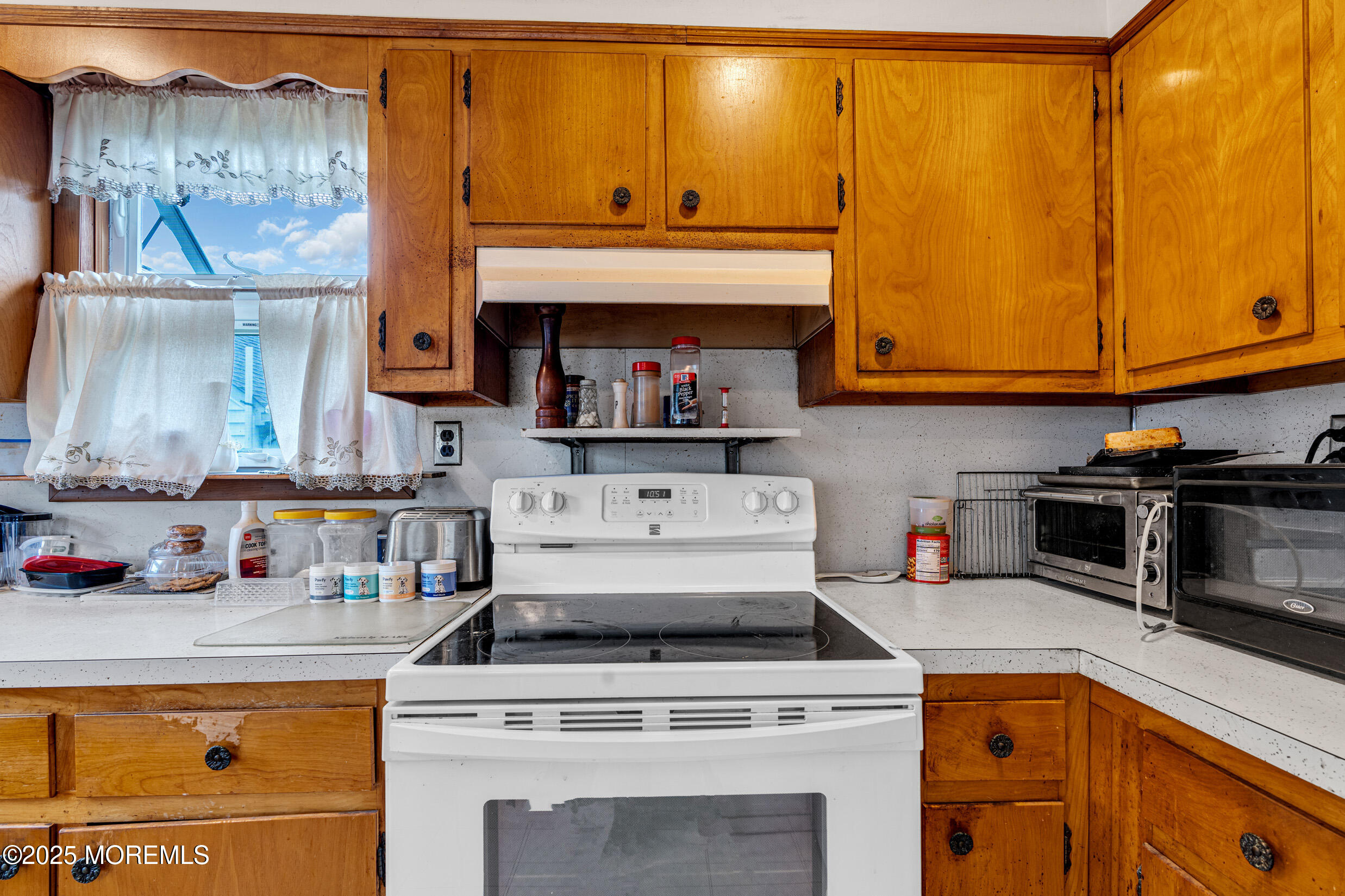 119 George Road Toms River, NJ 08753 - Photo 12 of 29 a kitchen with a stove and a microwave