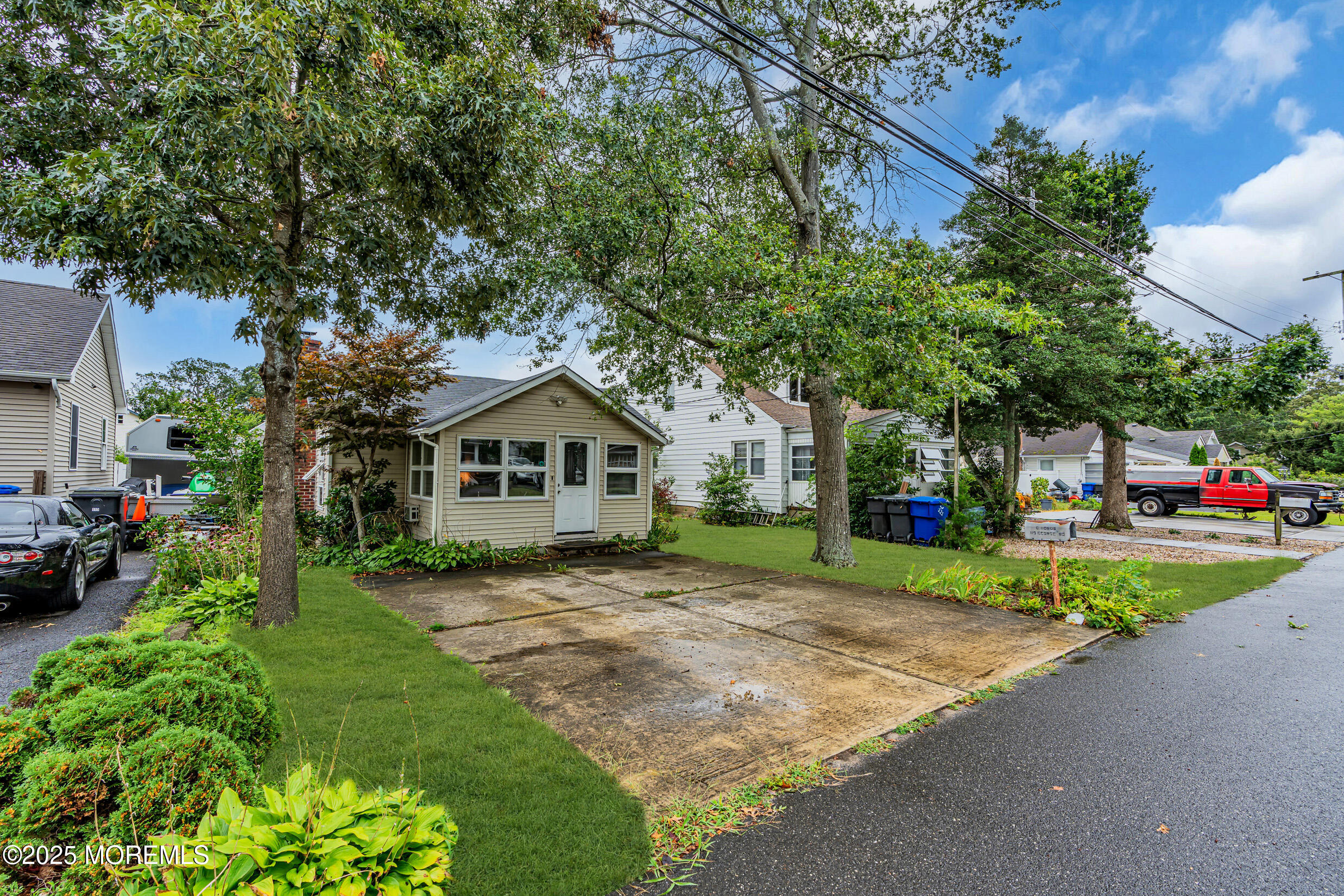 119 George Road Toms River, NJ 08753 - Photo 2 of 29 a front view of a house with a yard and garage