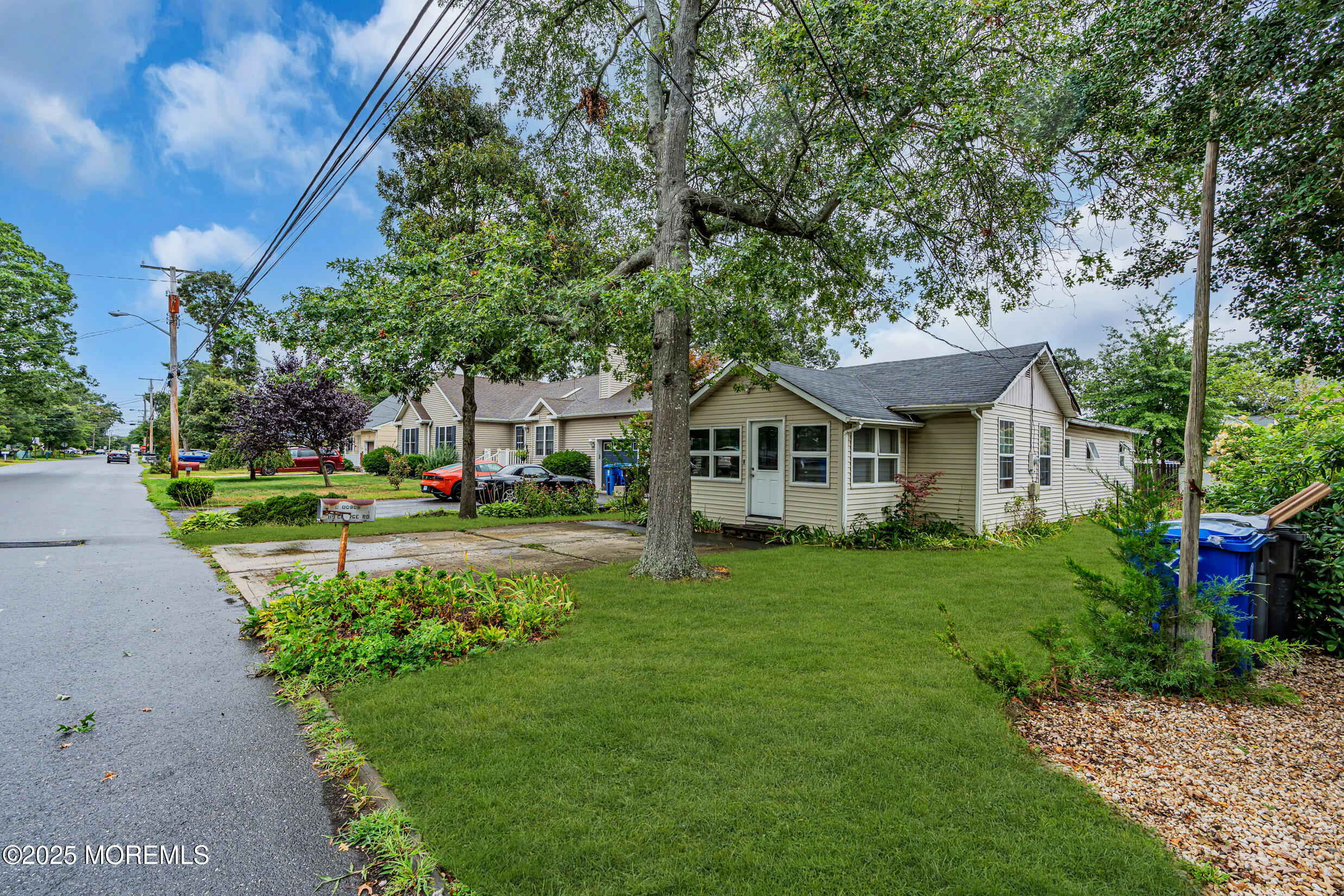 119 George Road Toms River, NJ 08753 - Photo 4 of 29 a front view of a house with a yard