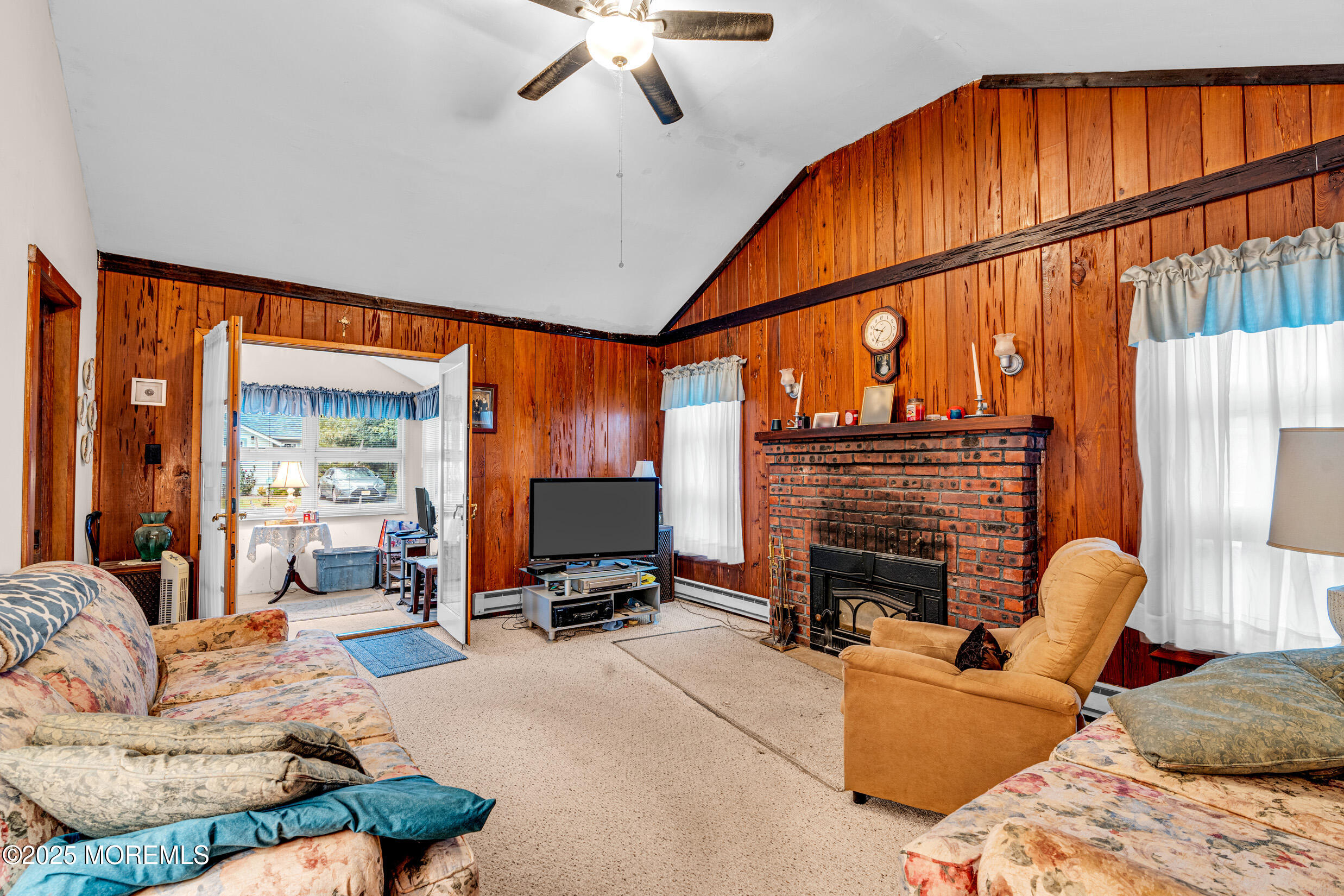 119 George Road Toms River, NJ 08753 - Photo 5 of 29 a living room with furniture a fireplace and a flat screen tv
