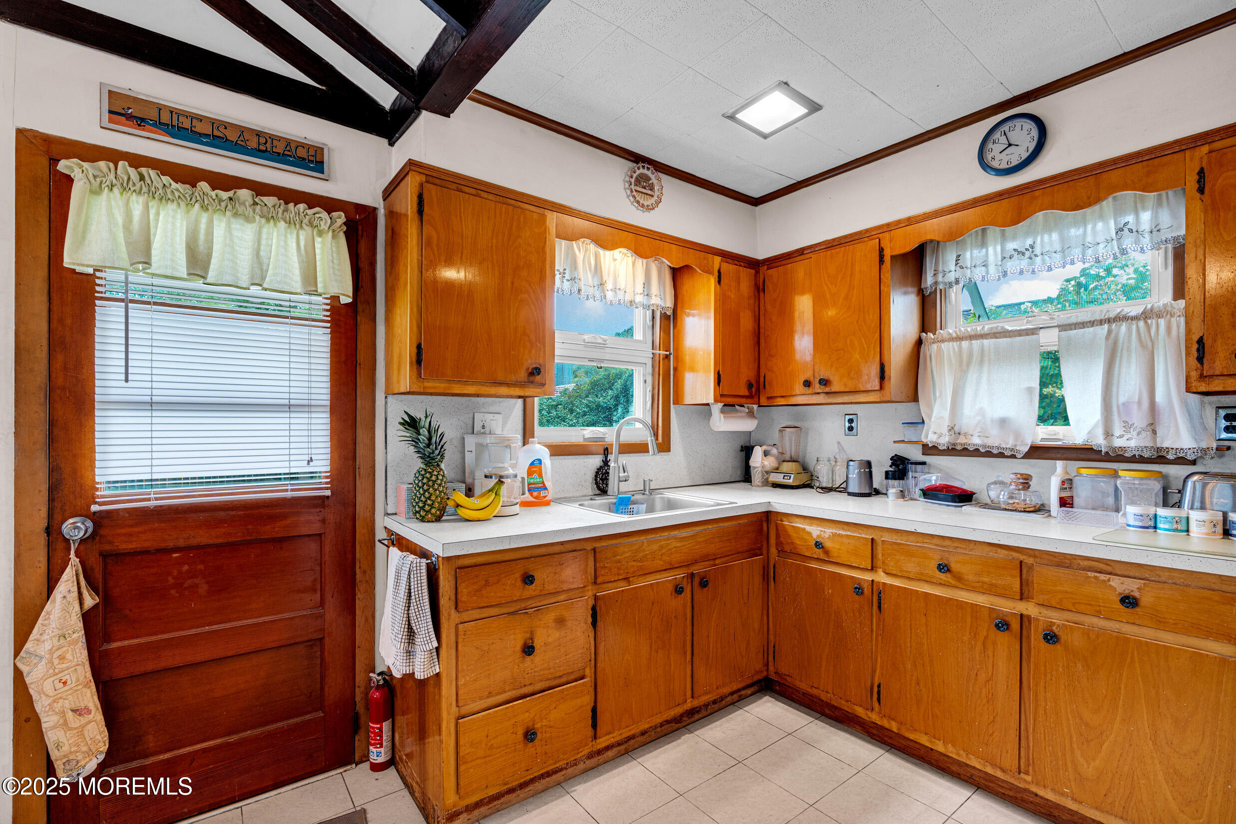 119 George Road Toms River, NJ 08753 - Photo 9 of 29 a kitchen with a sink window and cabinets