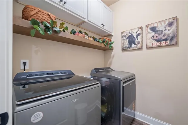 a living room with furniture windows and a chandelier