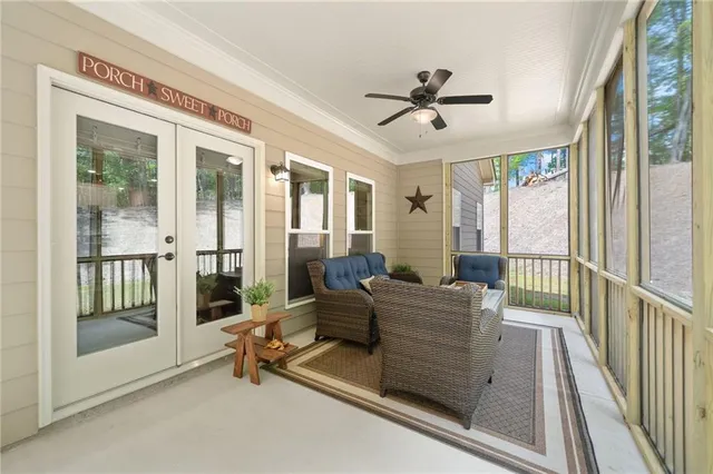 a spacious bedroom with a bed and a chandelier