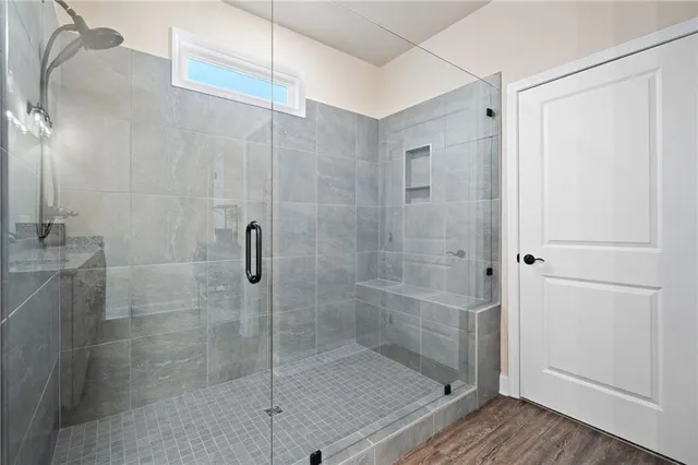 a bedroom with two beds and a window