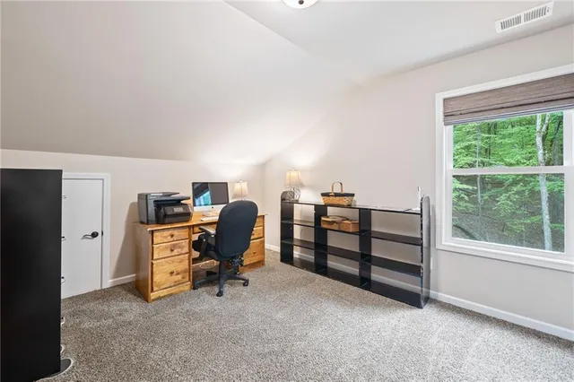 a view of a house with backyard and porch