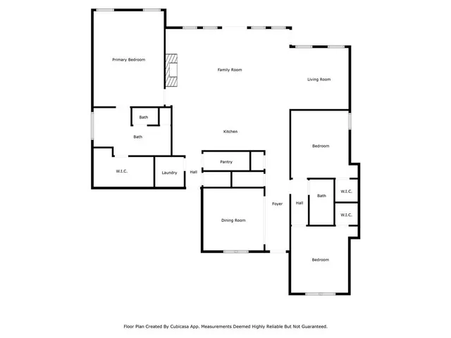 a sign of golf club on a wall under a tree