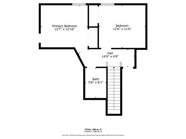 an aerial view of residential house with outdoor space and trees all around