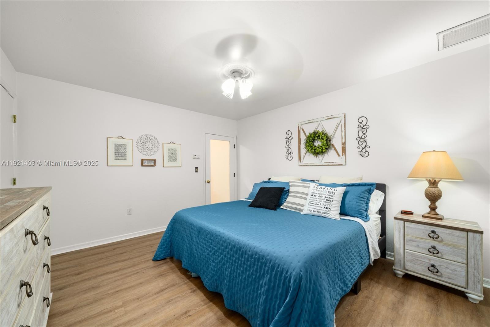 2551 Lakeview Drive Sebring, FL 33870 - Photo 32 of 73 a bedroom with a bed and a window