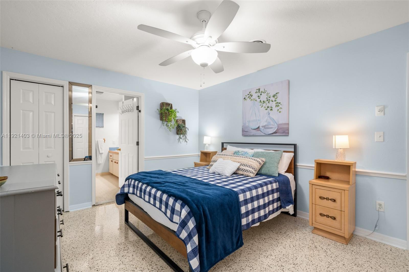 2551 Lakeview Drive Sebring, FL 33870 - Photo 40 of 73 a bedroom with a bed and a chandelier
