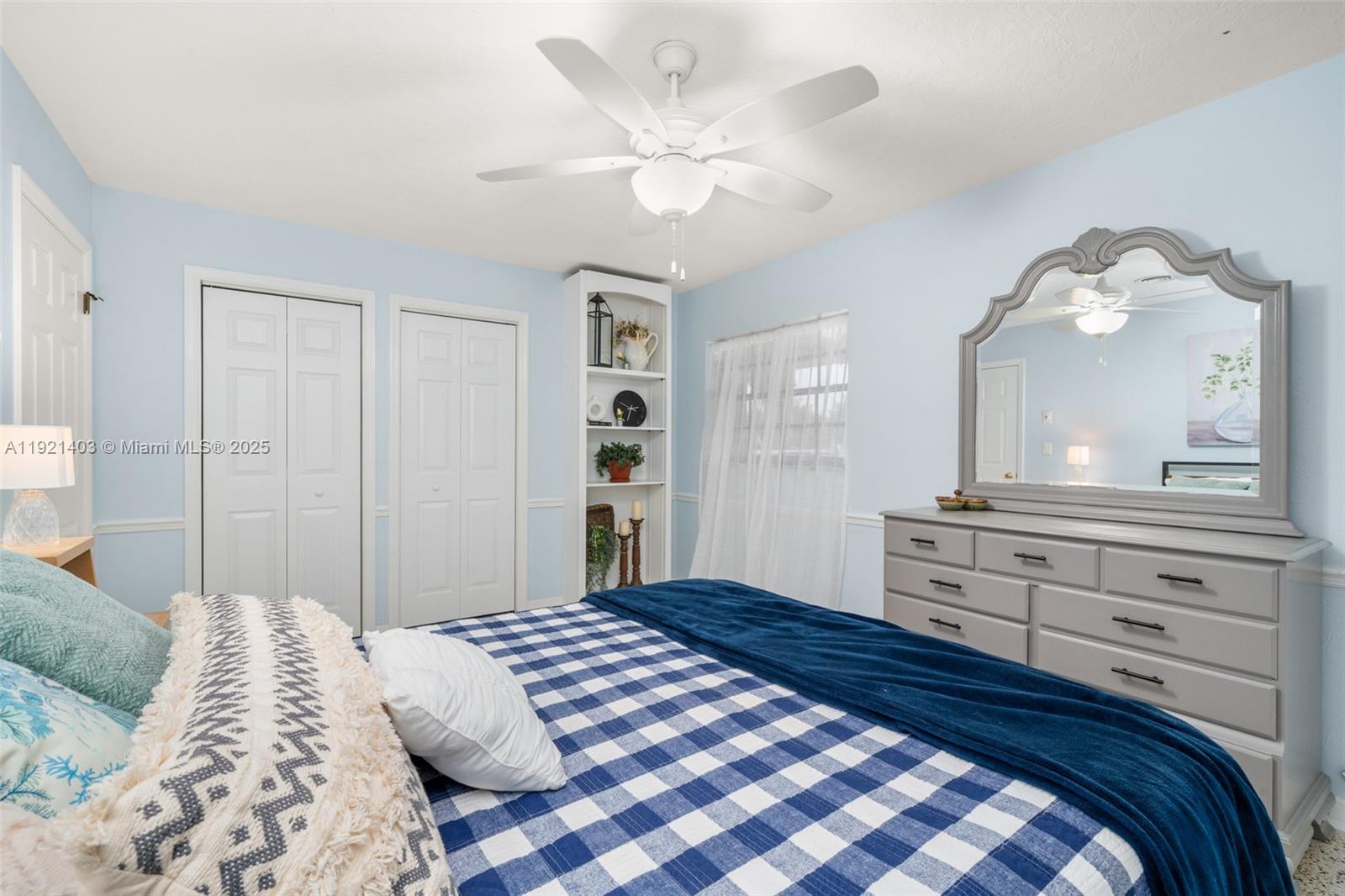 2551 Lakeview Drive Sebring, FL 33870 - Photo 42 of 73 a bedroom with a bed and a chandelier