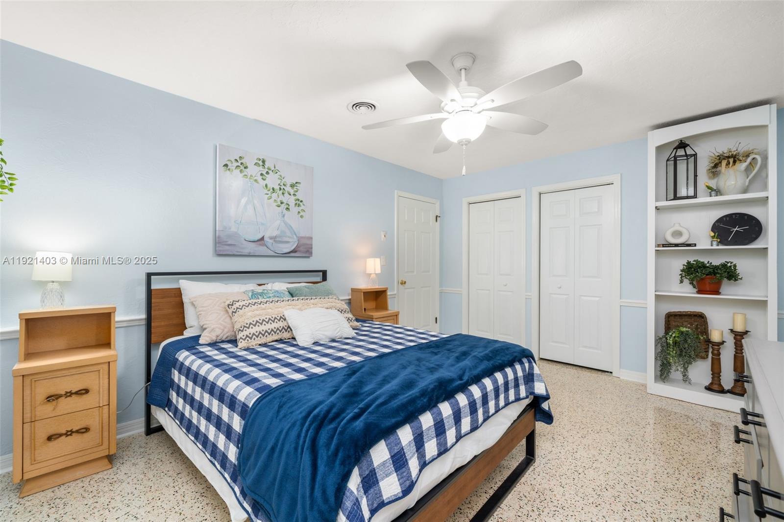 2551 Lakeview Drive Sebring, FL 33870 - Photo 43 of 73 a bedroom with a bed and a chandelier