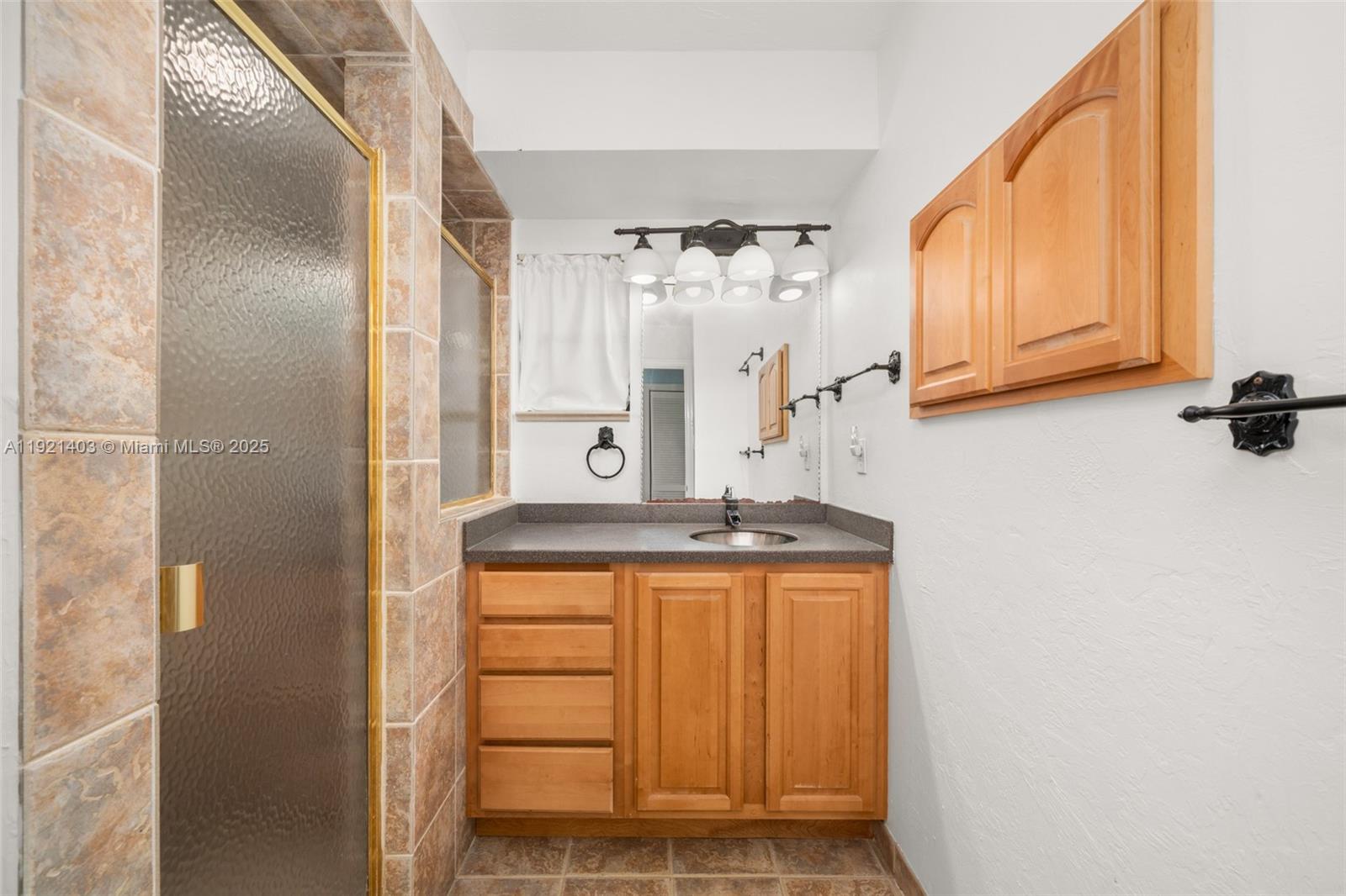 2551 Lakeview Drive Sebring, FL 33870 - Photo 50 of 73 a bathroom with a granite countertop sink and a mirror