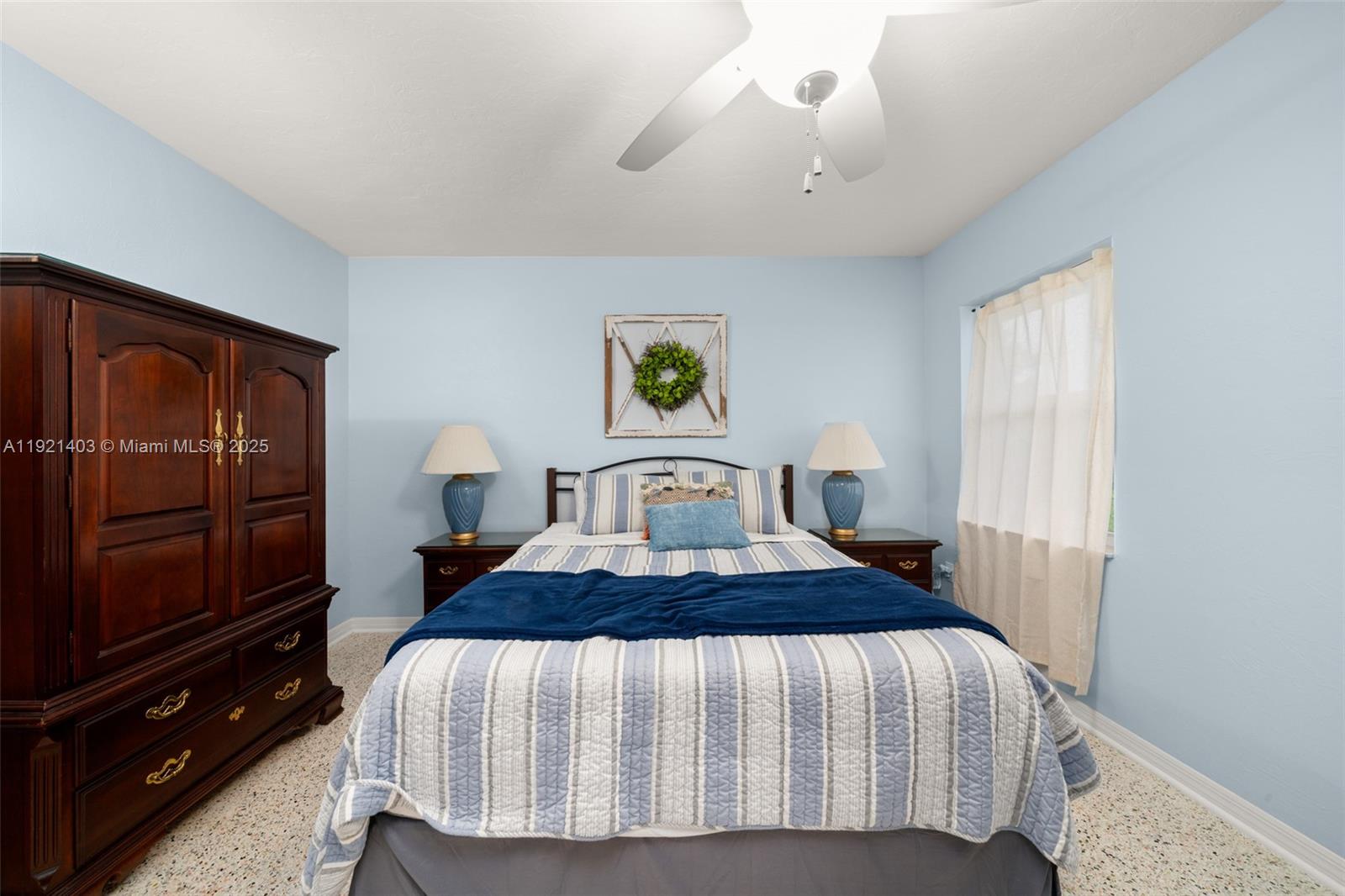 2551 Lakeview Drive Sebring, FL 33870 - Photo 53 of 73 a bedroom with a bed and a flat tv screen on dresser