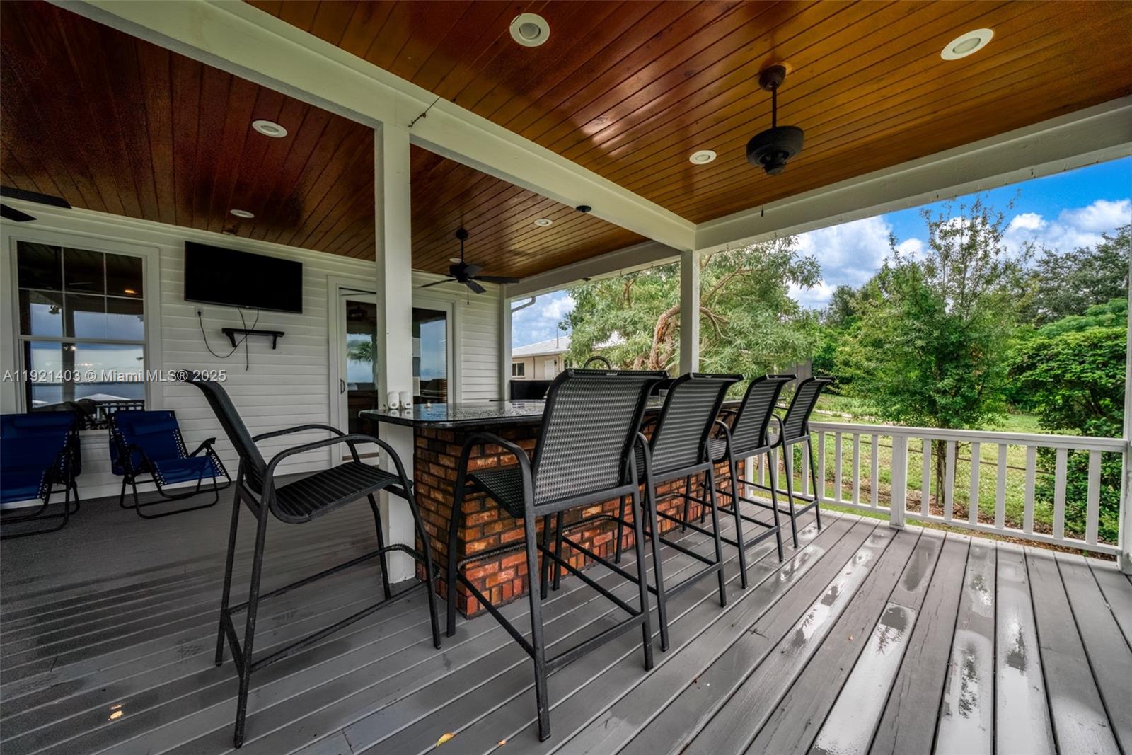 2551 Lakeview Drive Sebring, FL 33870 - Photo 65 of 73 a view of a patio with table and chairs with wooden floor