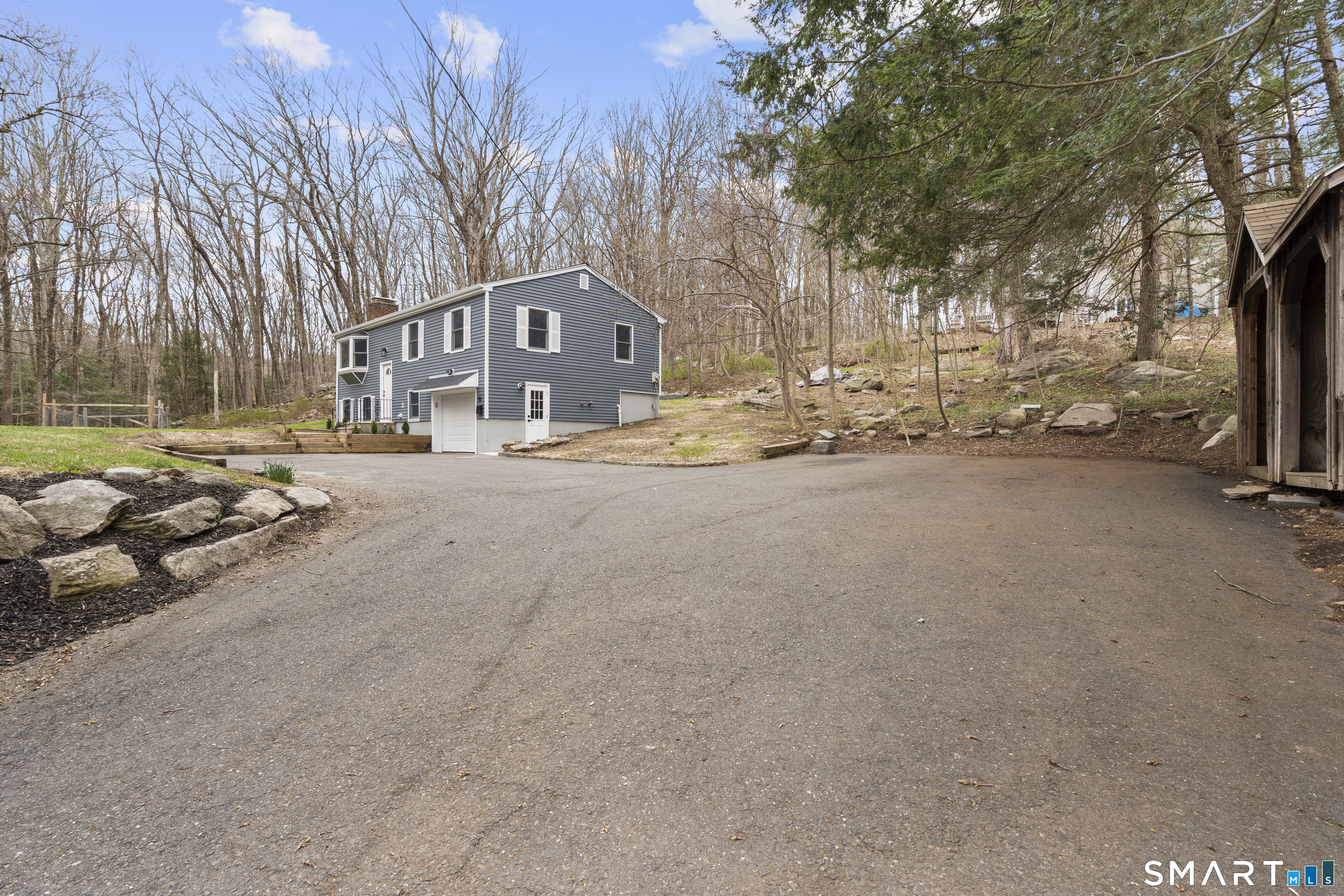 70 Dayton Road Redding, CT 06896 - Photo 32 of 38 a view of a street with a building