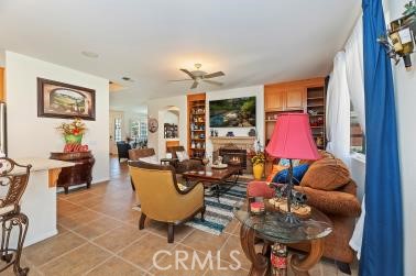 41606 Slice Way Temecula, CA 92591 - Photo 12 of 44 a living room with furniture a rug and a lamp