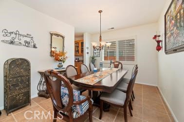 41606 Slice Way Temecula, CA 92591 - Photo 14 of 44 a view of a dining room with furniture window and outside view