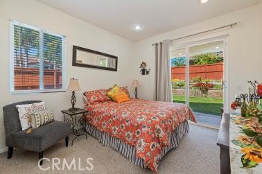 41606 Slice Way Temecula, CA 92591 - Photo 16 of 44 a bedroom with a bed and a couch