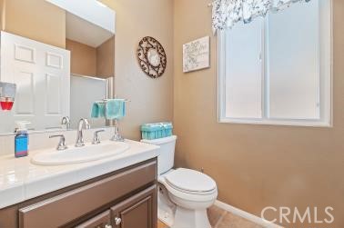 41606 Slice Way Temecula, CA 92591 - Photo 17 of 44 a bathroom with a sink mirror vanity and toilet