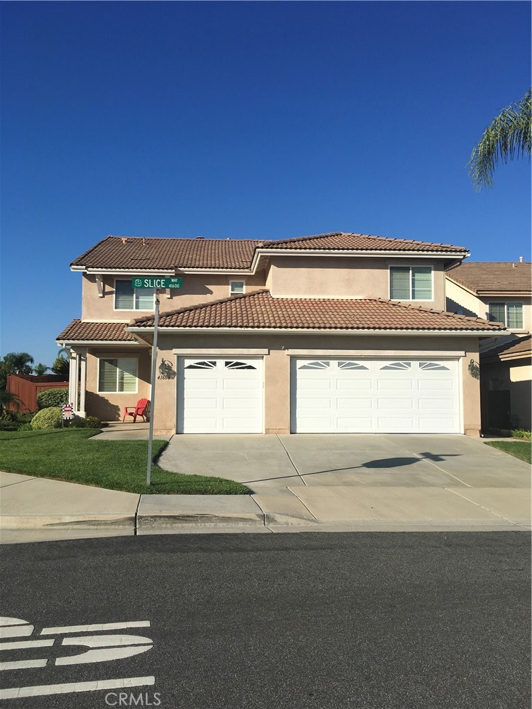 41606 Slice Way Temecula, CA 92591 - Photo 2 of 44 a front view of a house with a yard and garage