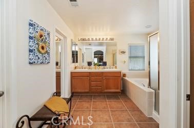 41606 Slice Way Temecula, CA 92591 - Photo 24 of 44 a large white room with a mirror and a sink