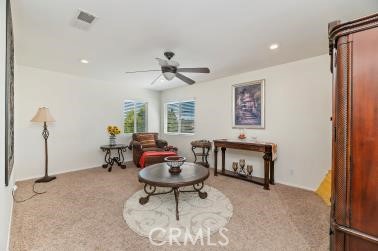 41606 Slice Way Temecula, CA 92591 - Photo 26 of 44 a living room with furniture a window and a chandelier