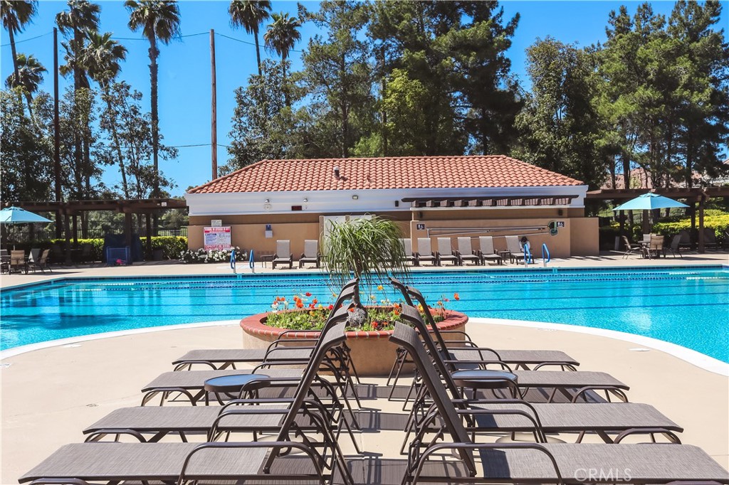 41606 Slice Way Temecula, CA 92591 - Photo 41 of 44 a view of a swimming pool with lounge chairs