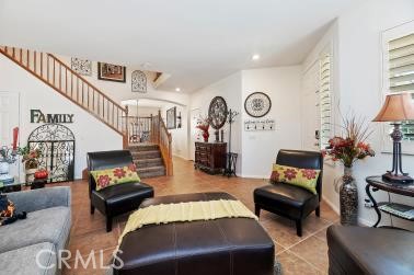 41606 Slice Way Temecula, CA 92591 - Photo 6 of 44 a living room with furniture and a clock