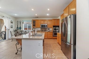 41606 Slice Way Temecula, CA 92591 - Photo 9 of 44 a kitchen with stainless steel appliances granite countertop a refrigerator and a sink