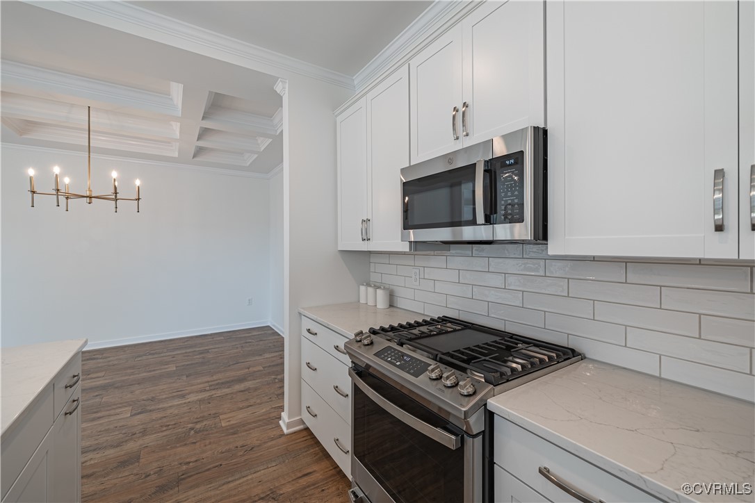 6649 Mayland Ridge Lane Moseley, VA 23120 - Photo 11 of 32 a kitchen with granite countertop a stove and a microwave