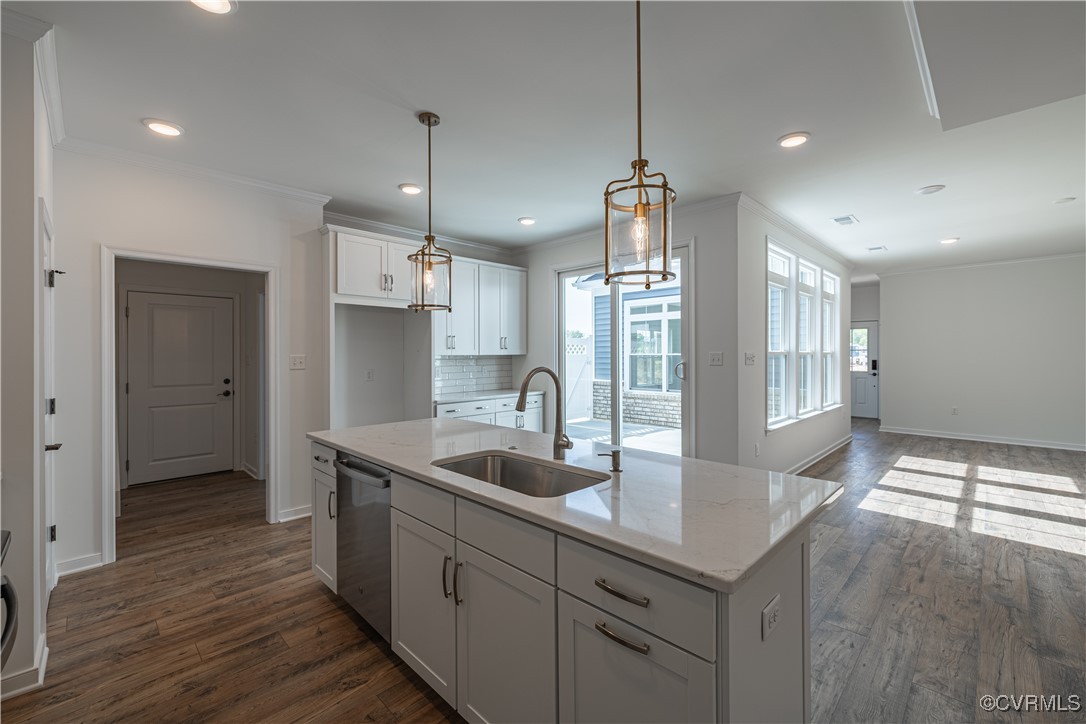 6649 Mayland Ridge Lane Moseley, VA 23120 - Photo 12 of 32 a kitchen with stainless steel appliances granite countertop a sink a refrigerator and a wooden cabinets