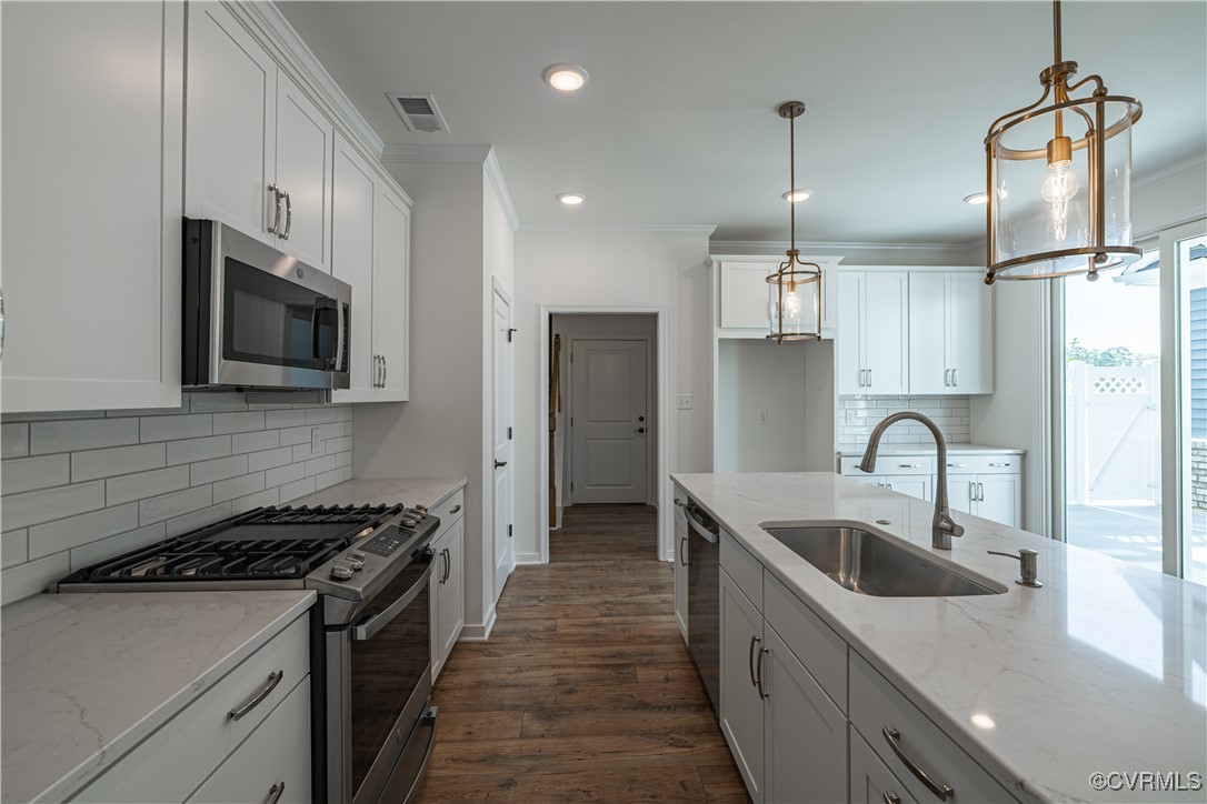 6649 Mayland Ridge Lane Moseley, VA 23120 - Photo 13 of 32 a kitchen with stainless steel appliances granite countertop a sink a stove and a refrigerator