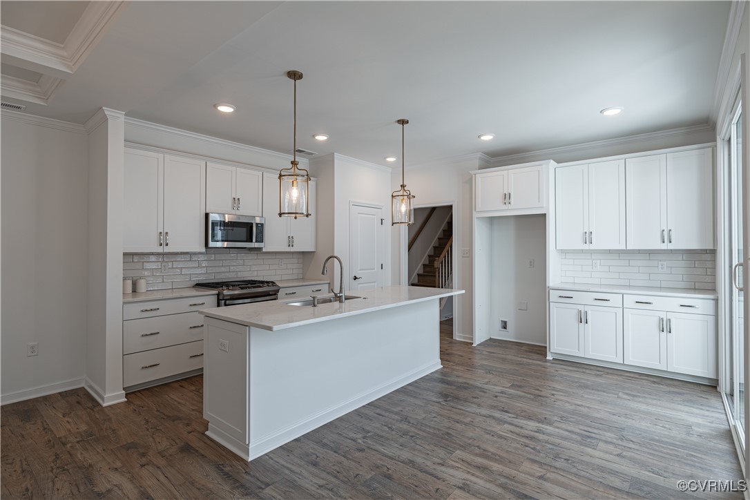 6649 Mayland Ridge Lane Moseley, VA 23120 - Photo 14 of 32 a kitchen with white cabinets stainless steel appliances and sink