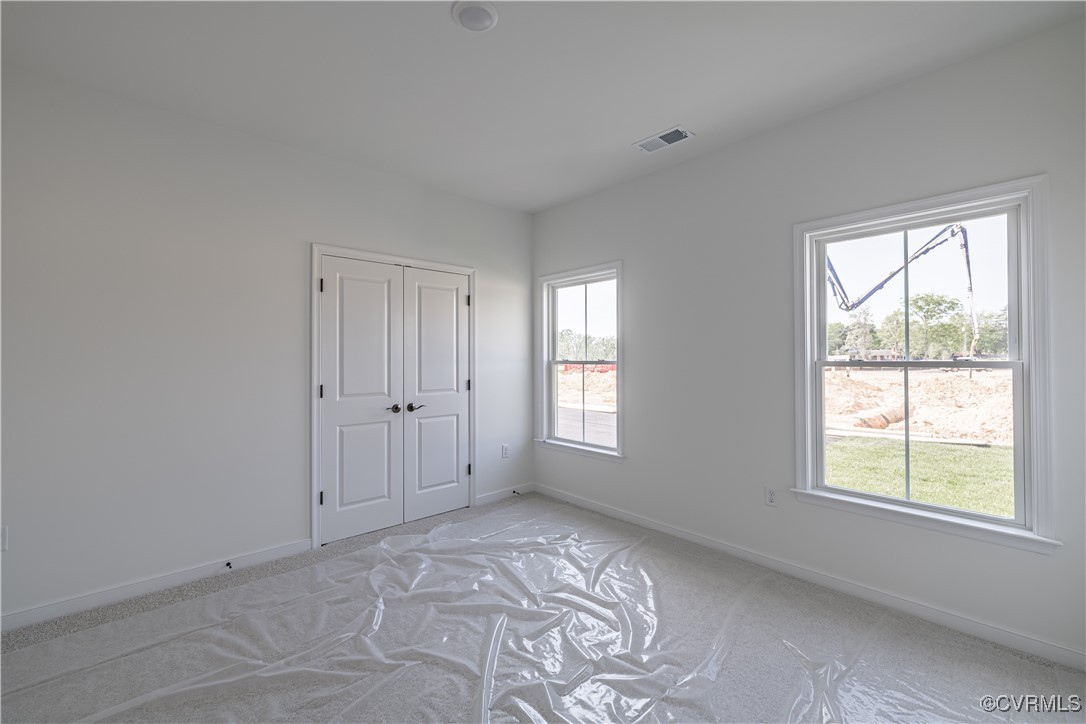 6649 Mayland Ridge Lane Moseley, VA 23120 - Photo 19 of 32 a view of an empty room with a window